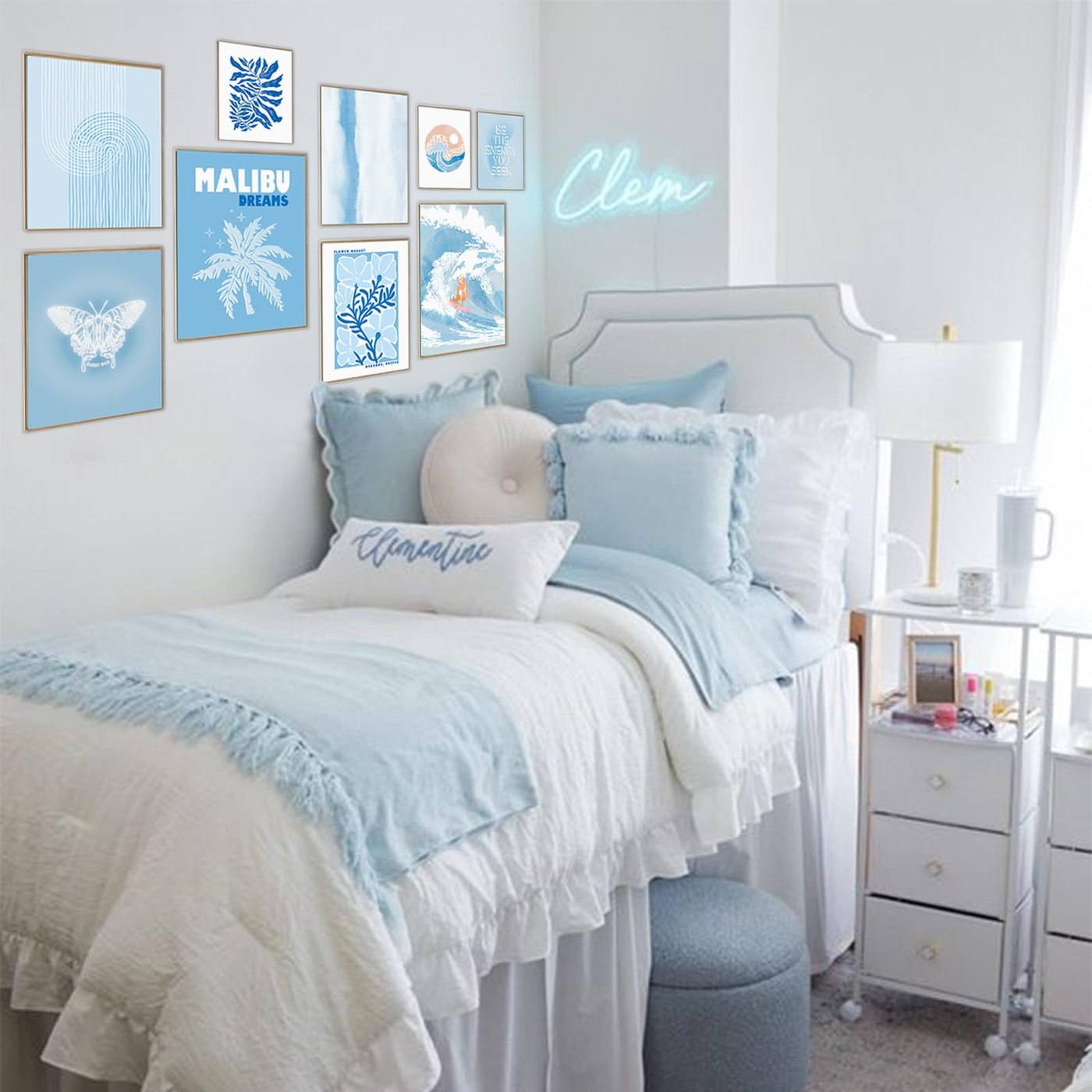 Coastal styled dorm room with soft blue bedding and gallery wall