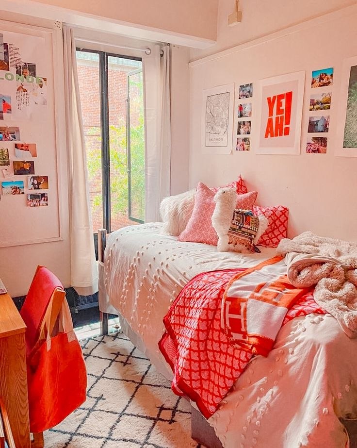 Preppy styled dorm room with pink and orange gallery wall