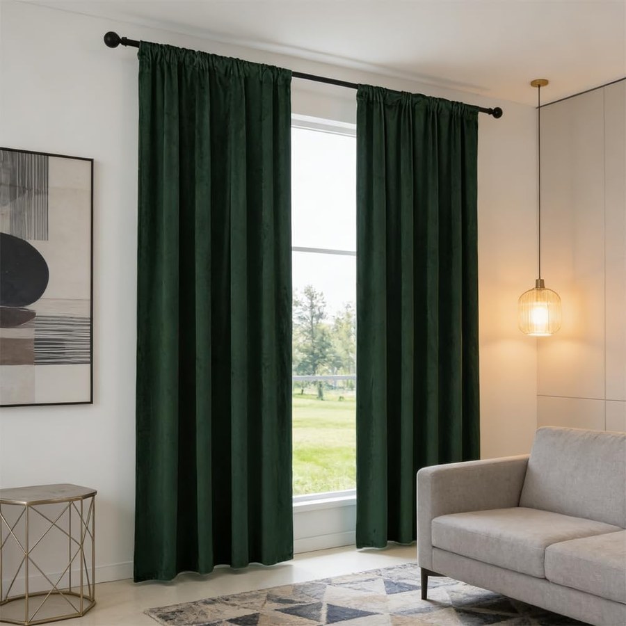 Deep green velvet curtain panels styled in a dorm room