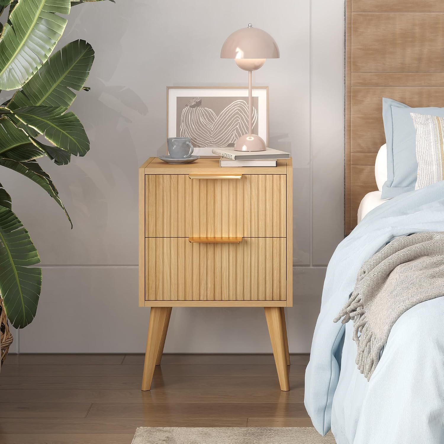 Light wood nightstand styled in a dorm room