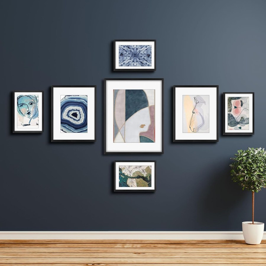 Dorm wall styled with a black frame gallery wall art set